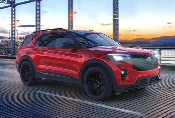 A red 2025 Ford Explorer driving on a bridge near Anderson, Indiana
