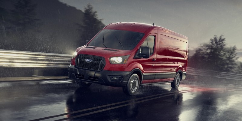 Red 2025 Transit Van Running roads 