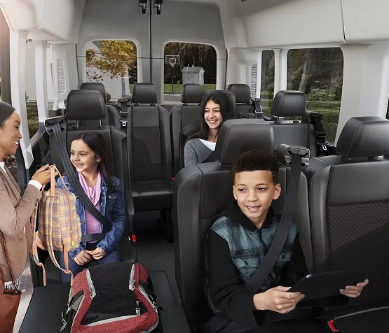 Passengers seated inside a Ford Transit Passenger Van